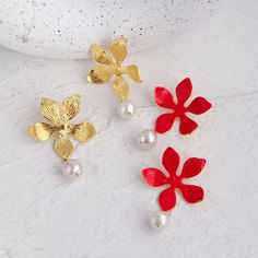 Free shipping worldwide! These stunning earrings are a piece of art, a perfect choice to upgrade your polished look and add more glamour to the air. The red flowers are colored using the overglaze enameling technique, a particular method of decorating porcelain. During such a process, the surface of the metal is fired, glazed then fixed in a second firing at a relatively low temperature, making the color applied durable e fresh. Flower Earrings Gold, Gold Dipped, Earring Sale