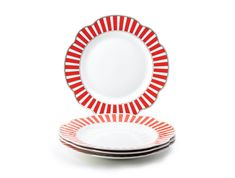 red and white plates stacked on top of each other in front of a white background