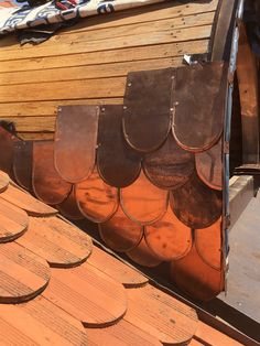 the roof is covered with wooden shingles