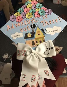 a person wearing a graduation cap with flowers on it