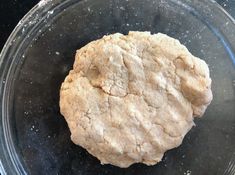 a cookie is sitting in a glass bowl