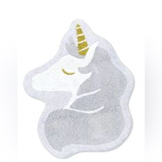 an image of a white unicorn with gold horn