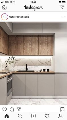 an instagram photo of a kitchen with wood cabinets and marble counter tops