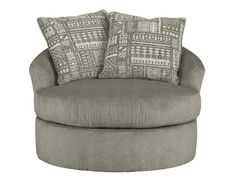 a large gray chair with two pillows on it's back and the seat upholstered