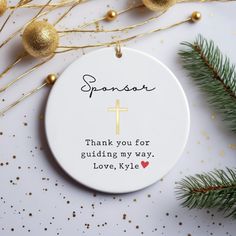 a white ornament with a cross on it that says, thank you for guiding my way, love, kylie