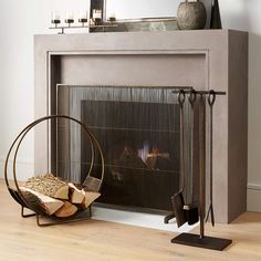 a fireplace with a fire in it next to a mirror