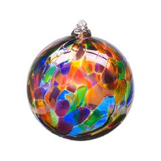 a multicolored glass ornament hanging from a string on a white background