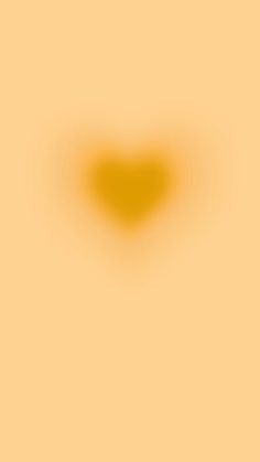 an orange heart shaped object in the middle of a light yellow background with black dots