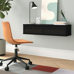 an office chair sitting in front of a desk with a potted plant on it