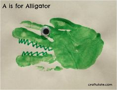 a green handprint with the words a is for alligator