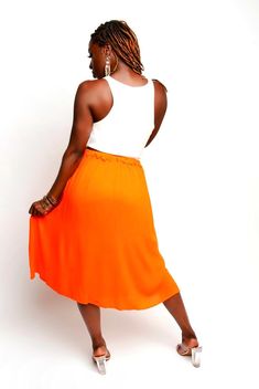 Circle Skirt, Mid-length. 100% Rayon Chic Stretch Orange Skirt, Chic Flowy Skirt With Button Closure, Beach Skirt With Button Closure, Chic Knee-length Skirt For Vacation, Spring Asymmetrical Buttoned Skirt, Asymmetrical Button Skirt For Spring, Spring Asymmetrical Skirt With Buttons, Vacation Pleated Midi Length Skirt, Chic Knee-length Orange Skirt