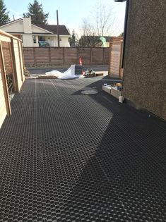 the inside of a building with metal grates on the floor and in front of it