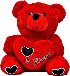 a red teddy bear with hearts on it's chest