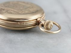 This antique pocket watch dates to 1885 and is in excellent condition! Ornately engraved on the antique rose gold case is a "C" monogram. This is a 6 Size watch, bearing a fine 11 Jewel movement. The face is handsome and elegant. Movement Size: 6 Size Movement Type: Waltham Setting Method: Stem Jewel Count: 11 Jewel Year of Manufacture: 1885 Country of Origin of Movement: USA Country of Origin of Case: USA Condition of Movement: Running and Keeping Time Well Case Material: 14K Antique Rose Gold C Monogram, Antique Pocket Watch, Vintage Clocks, Gold Pocket Watch, Usa Country, Clock Repair, Pocket Watch Antique, Cameo Ring, Open Face