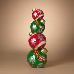 three christmas ornaments stacked on top of each other