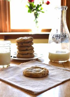 cookies and milk are sitting on a table