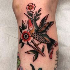 a bird with flowers on its leg