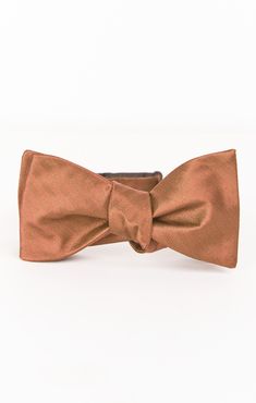 Hey babes! Does your boo need a new bow tie for your bestie's big day!? Well we have found the perfect accessory for him! Mumu (mens) weddings is finally here! The Josh Bow Tie is the OG formal look that does no man wrong! He is the life of the party and the best date in town! Whether he's a guest or a groomsmen, now you both can be in Mu when your watching an "I do!"This color was created to compliment our Copper dresses, due to the varying fabrics, there may be slight shading discrepancies between the ties and dresses Dapper Adjustable Satin Bow Tie, Adjustable Satin Bow Tie In Dapper Style, Classic Gold Bow Tie For Groom, Gold Classic Bow Tie For Groom, Adjustable Satin Bow Tie For Wedding, Adjustable Detachable Bow For Wedding, Dapper Bow Tie With Detachable Bow For Weddings, Dapper Detachable Bow Tie For Weddings, Classic Detachable Bow Tie For Groom