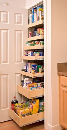 an open pantry door with food in it