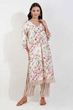 Ivory kurta with vintage floral print, embellished with sequin border and finished with lace work. Paired with stripe print pant and dupatta. - Aza Fashions Elegant Silk Palazzo Set With Floral Print, Elegant Straight Kurta With Floral Print, Elegant Silk Kurta With Floral Print, Elegant V-neck Floral Print Kurta, White V-neck Kurta With Printed Motifs, Off White Floral Print Kurta For Wedding, Elegant White Palazzo Set With Floral Print, Elegant Off White Sets With Printed Motifs, Elegant Off White Sets With Floral Print