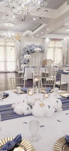 a banquet room set up with blue and white decor