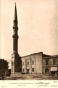 an old black and white photo of a building with a steeple in the middle