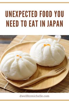 two buns on a plate with text overlay that says unexpected food you need to eat in japan