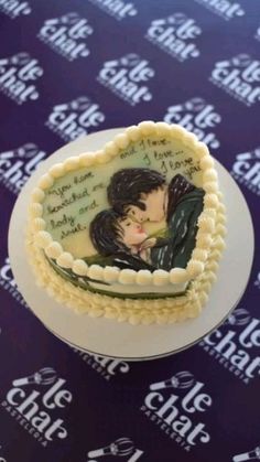 a cake decorated with an image of two people kissing