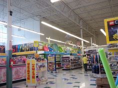 the inside of a toy store filled with toys