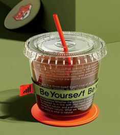 a plastic cup with a straw in it