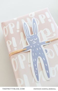 a pink and white box with a bunny sticker on it