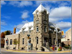 an old stone building with a clock tower