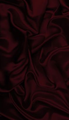 an image of a red cloth textured with silky folds and wrinklings