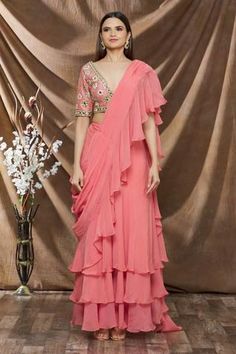 Peach organza saree with ruffle detailing. Paired with blouse in sequin, cutdana embroidered floral motifs. Peach Organza Saree, Dhoti Saree, Cotton Sarees Handloom, Ruffle Sarees, Organza Embroidery, Ruffle Saree, Lehenga Saree, Organza Saree, Blouse For Women