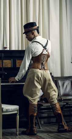 Tailored Cincher corset by Dark Garden in brown leather: $745 / Photo: Joel Aron / Model: Brandon Steampunk Male, Dieselpunk Fashion, Leather Braces, Steampunk Man, Dark Garden, Steampunk Men, Steampunk Couture, Cincher Corset