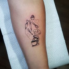 a person with a tattoo on their leg has a cupcake and knife in it