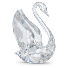 a crystal swan figurine on a white background