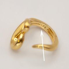 Preowned Tiffany & Co. Elsa Peretti Open Heart Ring crafted in 18k yellow gold  Ring Size: 5.75  Approximate Weight: Gross - 10.7 grams  Approximate Measurement: Ring Top 0.7" at widest  Hallmarks: 18k © Tiffany & Co. Peretti Tiffany Gold T Ring, Open Heart Ring, Vintage Tiffany, Elsa Peretti, Ring Crafts, 18k Yellow Gold Ring, Open Heart, Yellow Gold Ring, Yellow Gold Rings