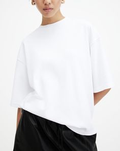 Looking for a versatile styling option? Meet the Amelie T-Shirt. Made from organic cotton, it's shaped to a classic crew neck silhouette with dropped shoulders creating an oversized, boxy fit. At the back there's a slight curved hem to add more dimension to the shape. Soft to touch and easy to wear, it goes with everything - casual jeans, statement slip dresses, leather skirts... you name it.  Pullover Crew neck Short sleeve Dropped armhole shaping Curved hem White Boxy Cropped T-shirt For Everyday, Sporty White Boxy Fit T-shirt, White Boxy Fit Sporty T-shirt, White Boxy Classic T-shirt, Modern White Boxy Fit T-shirt, Leather Skirts, Fall Dress Outfit, Slip Dresses, Boxy Tee