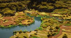 an aerial view of a river surrounded by trees