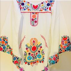 Mexican Dress Boho Mini Vintage Embroidered Hippie Long Bell Sleeves Mini Bodycon Cotton Organic Handmade Fairtrade Embroidery Unique Design From Aida Coronado One Of A Kind Rare Mexico Folk Art Short Version La Esperanza Design Magic Mexico Clothing Vintage Style Designer: Aida Coronado Embroidery: Indigenous Native Mexican Dresses Made With Love Aida Coronado Is A Fashion Designer Based In Mexico. She Is Known For Her Beautiful And Unique Designs That Incorporate Traditional Mexican Textiles A White Folk Style Wedding Dress, Summer White Kaftan With Intricate Embroidery, White Bohemian Embroidered Dress For Traditional Ceremonies, Folk Style Wedding Dress With Multicolor Embroidery, Folk Style White Embroidered Dress For Traditional Ceremonies, White Folk Embroidered Dress For Traditional Ceremonies, White Folk Embroidered Wedding Dress, White Folk Style Embroidered Wedding Dress, Spring White Kaftan With Floral Embroidery