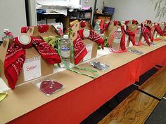 the table is set up with many items on it, including wine bottles and paper bags