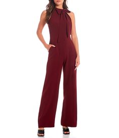 Shop for Vince Camuto Sleeveless Bow Neck Jumpsuit with Pockets at Dillard's. Visit Dillard's to find clothing, accessories, shoes, cosmetics & more. The Style of Your Life. Chic Fitted Bib Front Overalls, Chic Fitted Jumpsuits And Rompers With Bib Front, Sleeveless Solid Color Workwear Pantsuit, Solid Sleeveless Pantsuit For Work, Chic Sleeveless Overalls For Workwear, Chic Overalls For Workwear, Chic Sleeveless Fitted Overalls, Chic Fitted Sleeveless Overalls, Solid Color Strapless Jumpsuit For Work