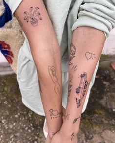 two people with matching tattoos on their arms