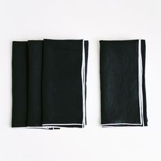 two black napkins sitting on top of each other