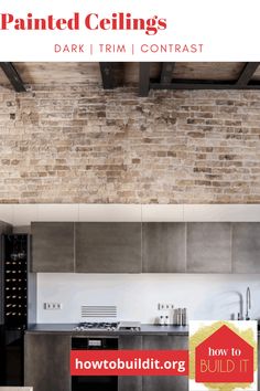 a kitchen with a brick wall next to a stove top oven