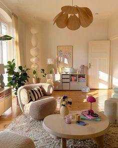 a living room filled with furniture and lots of windows