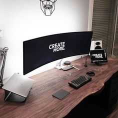 a desktop computer sitting on top of a wooden desk