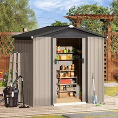 an outdoor storage shed with the door open and shelves full of items in front of it