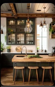 a kitchen with two stools and an island in the middle, surrounded by potted plants